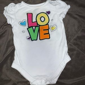 “Love” onesie